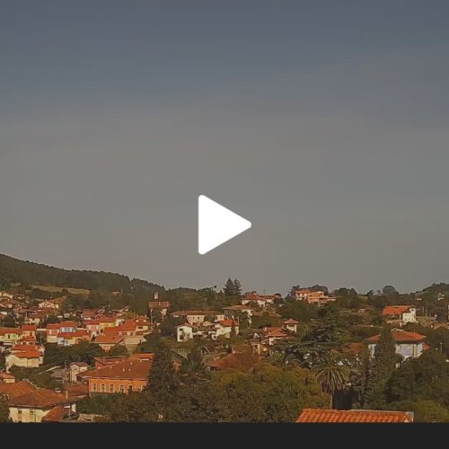Colunga, Spain Live Webcam: Asturian Village & Hillside Views